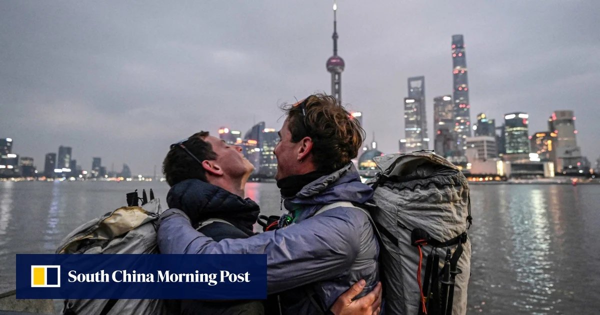 French pair arrives in Shanghai, China, after trekking more than 12,000 kilometers in 518 days.