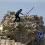 Lebanese Man Takes Down Israeli Flag from Southern Lebanon Castle