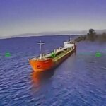Ukrainian Drone Dodges Russian Helicopter Fire to Target Oil Tanker